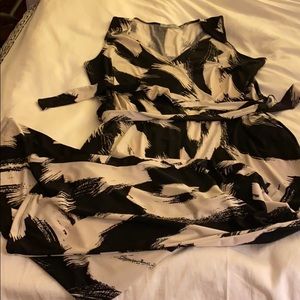 Black and white sleeveless wrap-front jumpsuit